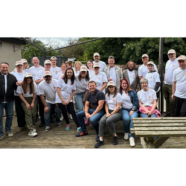 Team photo after the Be the Difference Day activities. The picture is of the team with their PDI hats on outside of the Sondes Arm pub in Rockingham, Corby